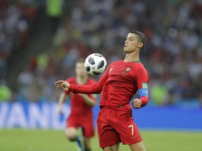 Portugal's Cristiano Ronaldo controls the ball during the group B match between Portugal and Spain at the 2018 soccer World Cup in the Fisht Stadium in Sochi, Russia, Friday, June 15, 2018.