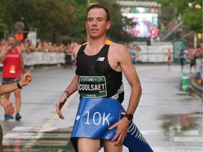 Reid Coolsaet is the first Canadian man to cross the finish line in the 10K run with a time Canadian woman, held in downtown Ottawa, during the Tamarack Ottawa Race Weekend, on May 28, 2016.