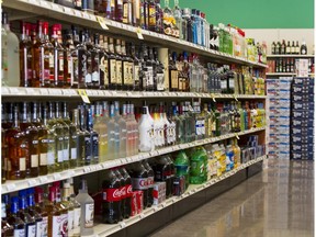 Shelves are filled with bottles of liquor at a 21st Amendment liquor store in Carmel, Ind., Thursday, Feb. 19, 2015. Indiana will keep the distinction of being the last state with a "blue law" banning Sunday carry-out alcohol sales after the sponsor of a bill that would have lifted the ban said Tuesday, 24 the measure is dead. (AP Photo/Doug McSchooler)