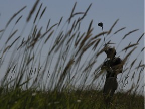 A.J. Armstrong watches his tee shot on the 11th hole during the Sun Life Financial Mens Amateur Championship at RedTail Landing Golf Club, in Edmonton Thursday July 19, 2018.