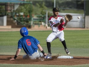 Edmonton Prospects shortstop Aidan Huggins makes a catch at second base before the arrival Brooks Bombers base-runner Conner Morro during Western Major Baseball League action on July 1, 2018, at RE/Max Field in Edmonton.