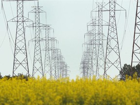 Power transmission lines are shown on the eastern edge of Calgary on Wednesday, July 18, 2018. Calgarians are using more AC power in the summer for items like air conditioning and fans. Jim Wells/Postmedia
