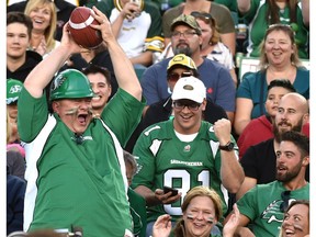 A Saskatchewan Roughriders fan caught the ball as the team took it to the Edmonton Eskimos 54 - 31 during CFL action at Commonwealth Stadium in Edmonton, August 25, 2017.
