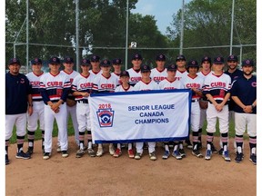 The Edmonton Cubs pose with their championship banner after winning the Canadian Senior Little League Championships in Edmonton on July 22, 2018.