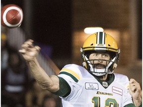 Edmonton Eskimos quarterback Mike Reilly throws a pass during second half CFL football action against the Montreal Alouettes in Montreal, Thursday, July 26, 2018.