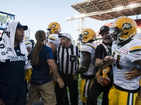 Toronto Argonauts linebacker Nakas Onyeka (41) shouts at Edmonton Eskimos wide receiver Nate Behar (11) during a scuffle in fourth quarter CFL action in Toronto on Saturday, July 7, 2018.