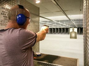 Man at shooting range. Target practice.