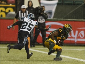 Edmonton Eskimos receiver D'haquille Williams (81) catches a touchdown throw in front of Toronto Argonauts defensive back Ronnie Yell (25) during the second half of CFL action at Commonwealth Stadium in Edmonton on July 13, 2018.