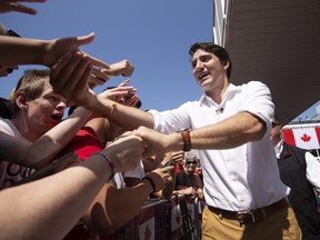 Prime Minister Justin Trudeau greets revellers during Canada Day festivities in Leamington Ont. Sunday, July 1, 2018.