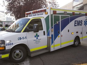 An Alberta Health Services ambulance is seen leaving the the Royal Alexandria Hospital in Edmonton, Alta., on Thursday, Oct. 16, 2014.