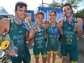 Team Australia, from left, Aaron Royle, Natalie Van Coevorden, Ashleigh Gentle and Jacob Birtwhistle take gold winning the mixed relay event during the ITU World Triathlon at Hawrelak Park in Edmonton, July 28, 2018. Ed Kaiser/Postmedia