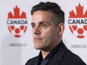Canada men's national soccer team newly-announced coach John Herdman speaks at a press conference at BMO Field in Toronto, Monday, February 26, 2018. Seeing Herdman in the middle of a soccer field, shouting orders with the Canadian crest on his chest, is a common sight.But that's where familiarity ends, as Herdman is no longer surrounded by a star-studded team featuring the likes of Christine Sinclair, Kadeisha Buchanan and Ashley Lawrence.