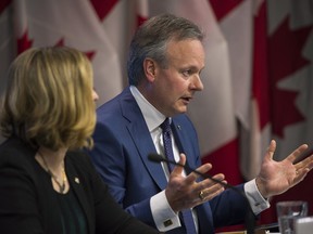 Stephen Poloz, Governor of the Bank of Canada, right, speaks while Carolyn Wilkins, senior deputy governor at the Bank of Canada, listens during a press conference in Ottawa, Ontario, Canada, on Thursday, June 7, 2018.