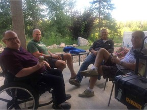 Cam Tait relaxes on his back patio with friends, from left, Dirk Kelm, Harvey Hiop and Randy Yeo. For column in July 8, 2018 Edmonton Sun. Supplied