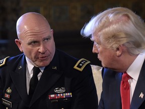 President Donald Trump, right, listens to Army Lt. Gen. H.R. McMaster, left, at Trump's Mar-a-Lago estate in Palm Beach, Fla., Monday, Feb. 20, 2017.