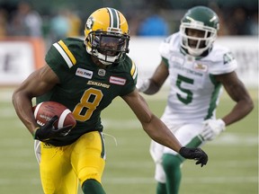 Edmonton Eskimos receiver Kenny Stafford battles the Saskatchewan Roughriders' Crezdon Butler (5) during first half CFL action at Commonwealth Stadium, in Edmonton on Aug. 2, 2018.