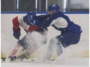 Jacson Alexander, right, tries to check Brett Kemp at Edmonton Oil Kings training camp at Rogers Place in Edmonton on Monday August 27, 2018.