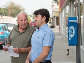 Leonard Siemens, left, and Firat Uray, president and owner of Rider Express Transportation, stand in front of Uray's business on 11th Avenue prior to speaking to media about the bus line taking over former Greyhound routes.