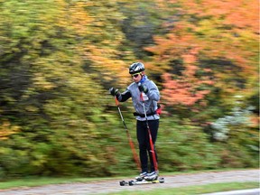 A roller skier cruises by amongst the autumn scenery along Saskatchewan Dr. in Edmonton, September 17, 2018.