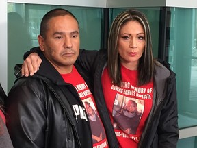 Alex Baptiste, brother of slain Calgary mom Dawns Echoes Baptiste, and cousin Louise Baptiste outside the Calgary Courts Centre on Monday, Sept. 24, 2018.