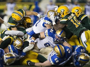 Edmonton Eskimos stop Winnipeg Blue Bombers quarterback Chris Streveler during second half CFL action on Saturday, Sept. 29, 2018 in Edmonton.