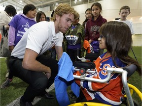 Edmonton Oilers captain Connor McDavid and the Edmonton Oilers Community Foundation are committing $85,000 over three years to Jumpstart in support of the Ever Active Schools initiative which helps facilitate sport and physical activity in Indigenous communities. McDavid (left) participated in the Jumpstart Games with 300 children at Commonwealth Stadium Recreation Centre on Sept. 11, 2018 after signing an autograph for fan Ciera Kootenay (right).