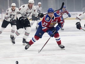 Edmonton Oil Kings forward Trey Fix-Wolansky battles the Red Deer Rebels during WHL action at Rogers Place on Sept. 21, 2018.