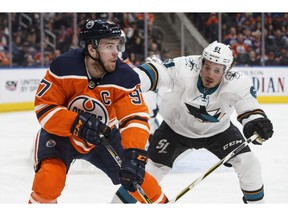 San Jose Sharks defenceman Justin Braun chases Edmonton Oilers centre Connor McDavid during second period NHL action in Edmonton, Alta., on Wednesday March 14, 2018.