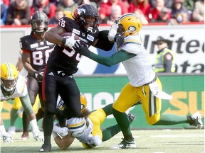 Calgary Stampeders Terry Williams battles Edmonton Eskimos defenders in first half action during the Labour Day Classic at McMahon stadium in Calgary on Monday September 3, 2018.