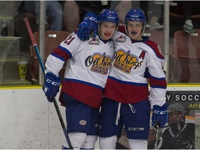 Edmonton Oil Kings Jake Neighbours celebrates his goal with teammate Will Warm against the Red Deer Rebels during third period WHL action at Servus Credit Union Place on Friday, Sept. 14, 2018 in St. Albert.