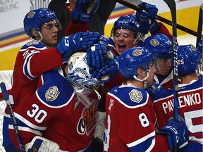 Edmonton Oil Kings teammates congratulate goalie Boston Bilous on earning a shut-out on the Swift Current Broncos defeating them 5-0 during WHL action at Rogers Place in Edmonton, September 28, 2018. Ed Kaiser/Postmedia