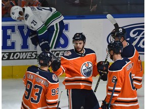Edmonton Oilers Ty Rattie (8) celebrates his first of three goals n the night with teammates against the Vancouver Canucks during NHL pre-season action at Rogers Place in Edmonton, September 25, 2018.