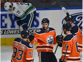 Edmonton Oilers Ty Rattie (8) celebrates his first of three goals n the night with teammates against the Vancouver Canucks during NHL pre-season action at Rogers Place in Edmonton, September 25, 2018.