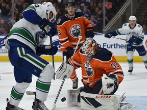 Edmonton Oilers goalie Cam Talbot (33) makes a save off Vancouver Canucks Bo Horvat (53) during NHL pre-season action at Rogers Place, Sept. 25, 2018.