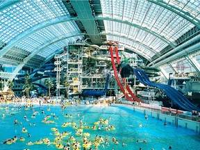 Swimmers play in West Edmonton Mall's indoor waterpark, which has a wave pool, water slides, children and family areas, a surfing pool and more.