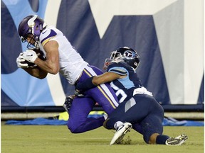 Minnesota Vikings wide receiver Brandon Zylstra, left, catches a 24-yard touchdown pass as he is defended by Tennessee Titans cornerback Trey Caldwell, right, in the second half of a preseason NFL football game Thursday, Aug. 30, 2018, in Nashville, Tenn.