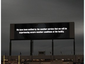 The scoreboard warns of severe weather, forcing a delay in CFL action between the Winnipeg Blue Bombers and Edmonton Eskimos in Winnipeg on Thurs., June 14, 2018.