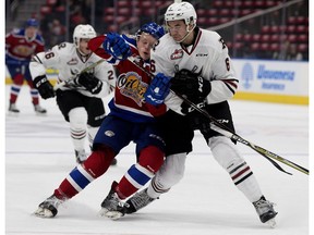 The Edmonton Oil Kings' Carter Souch (44) is checked by the Red Deer Rebels' Ethan Sakowich (6) during first period WHL action at Rogers Place, in Edmonton Friday Sept. 21, 2018.