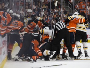 A third period melee between the Edmonton Oilers and Boston Bruins, in Edmonton on Thursday, Oct. 18, 2018. The Oilers won 3-2 in overtime.