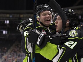 The Edmonton Oil Kings Wyatt McLeod (6) and Jake Neighbours (21) celebrate Neighbours' second period goal against the Lethbridge Hurricanes at Rogers Place, in Edmonton Sunday Oct. 28, 2018.