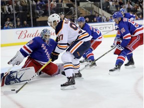 Connor McDavid of the Edmonton Oilers takes a shot against Henrik Lundqvist #30 of the New York Rangers in the third period during their game at Madison Square Garden on November 11, 2017 in New York City.