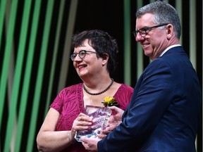 Paula Simons, shown here receiving an Alumni Honour Award from U of A president David Turpin in September, has been appointed to the Canadian Senate.