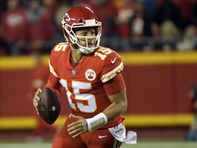 Chiefs quarterback Patrick Mahomes scrambles with the ball during first half NFL action against the Bengals in Kansas City, Mo., Sunday, Oct. 21, 2018.