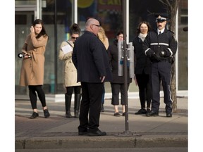 Don Belanger, the program manager for the Capital City Clean Up, shows the media new ashtray that have been installed, as cannabis legalization looms, city staff are setting up designated smoking areas along Edmonton's two most popular streets on Monday, Oct. 15, 2018 in Edmonton.