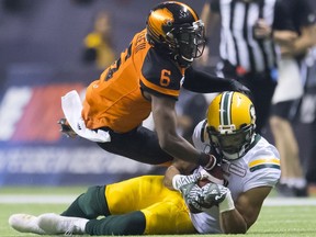 BC Lions defensive back T.J. Lee (6) takes down Edmonton Eskimos wide receiver Nate Behar (11) during CFL football action in Vancouver, B.C., on Friday, Oct. 19, 2018.