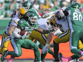 Saskatchewan Roughriders running back Tre Mason works his way up field during first half CFL action against the Edmonton Eskimos, in Regina on Monday, Oct. 8, 2018.