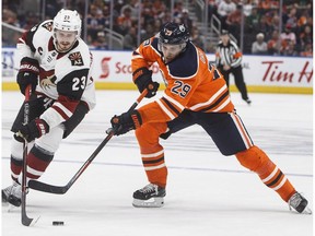 Arizona Coyotes Oliver Ekman-Larsson (23) and Edmonton Oilers' Leon Draisaitl (29) battle for the puck during third period preseason action in Edmonton on Thursday September 27, 2018.