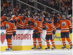 Edmonton Oilers celebrate a goal by Kailer Yamamoto (56) against the Calgary Flames during third period NHL preseason action in Edmonton on Saturday September 29, 2018.