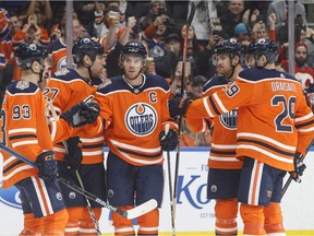 Edmonton Oilers celebrate a goal by Connor McDavid (centre) against the Calgary Flames during second period NHL preseason action in Edmonton on Saturday September 29, 2018.
