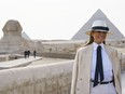 First lady Melania Trump visits the ancient statue of Sphinx, with the body of a lion and a human head, at the historic site of Giza Pyramids in Giza, near Cairo, Egypt, Saturday, Oct. 6, 2018.
